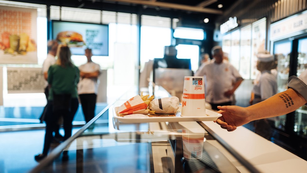 Staff handing over food over counter